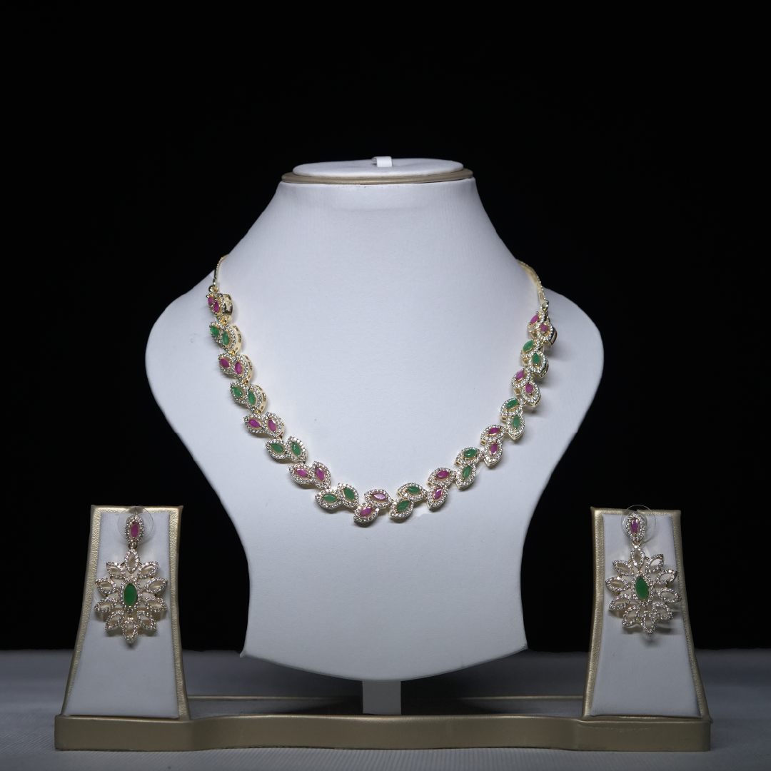 Revaaj Kundan Necklace Set with matching earrings, featuring emerald and ruby stones.