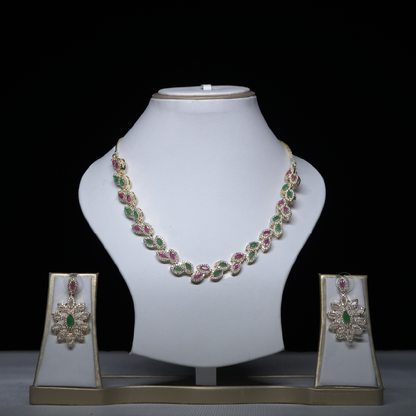 Revaaj Kundan Necklace Set with matching earrings, featuring emerald and ruby stones.