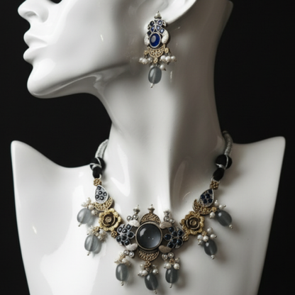 Antique gold necklace set with blue stones, pearl drops, and floral motifs by Revaaj Jewellery white