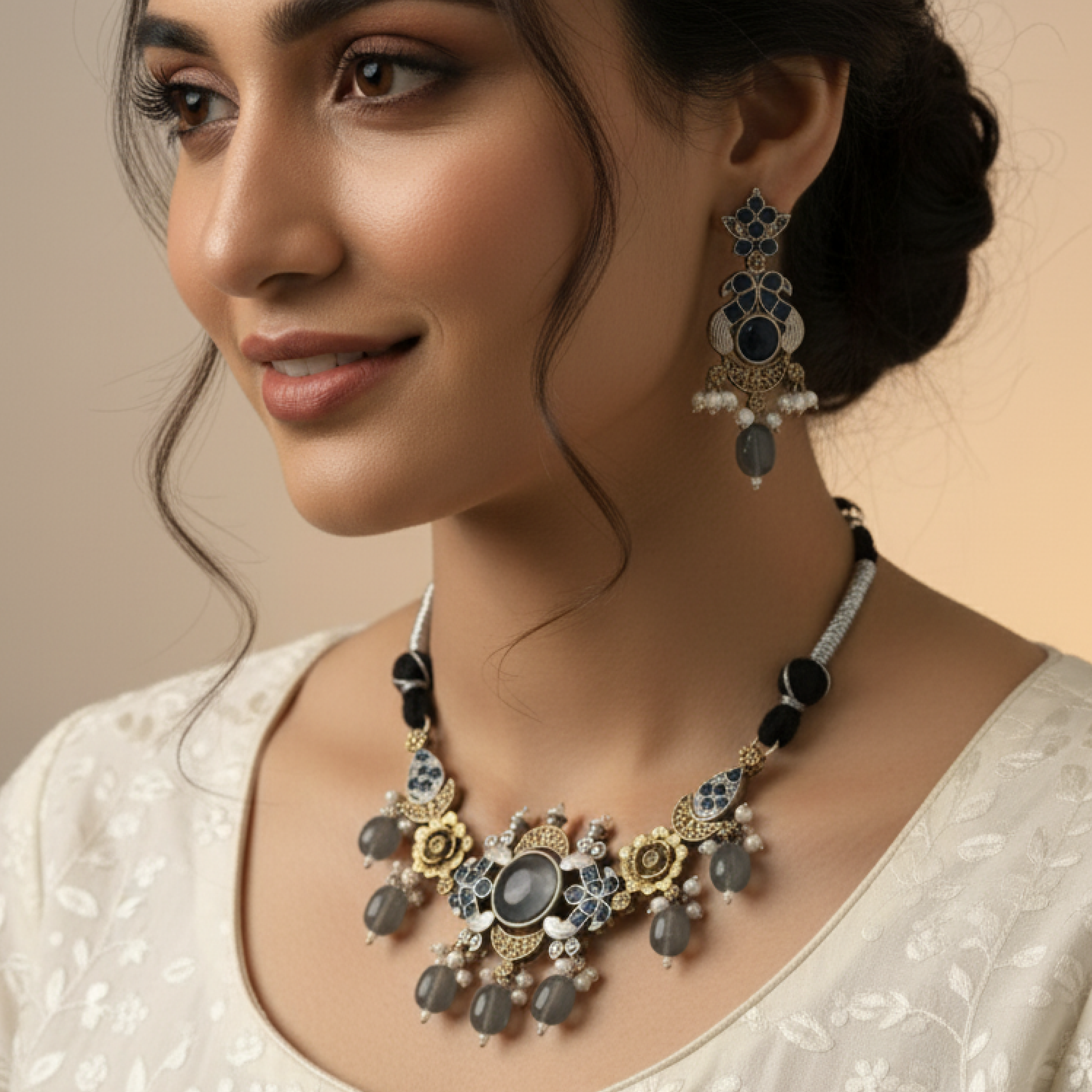 Antique gold necklace set with blue stones, pearl drops, and floral motifs by Revaaj Jewellery Stand