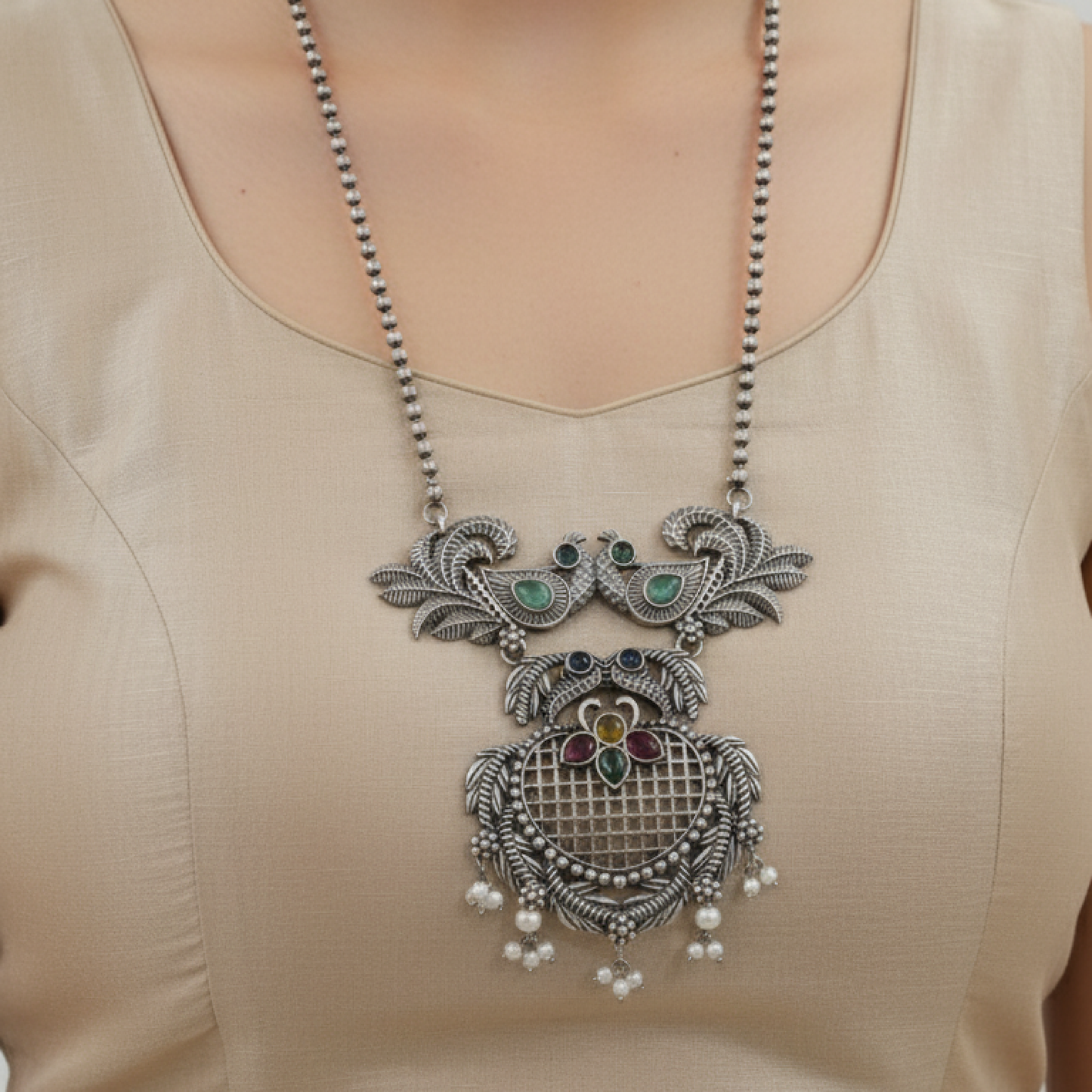 Oxidized silver necklace set with peacock design and multicolor stones by Revaaj Jewellery white