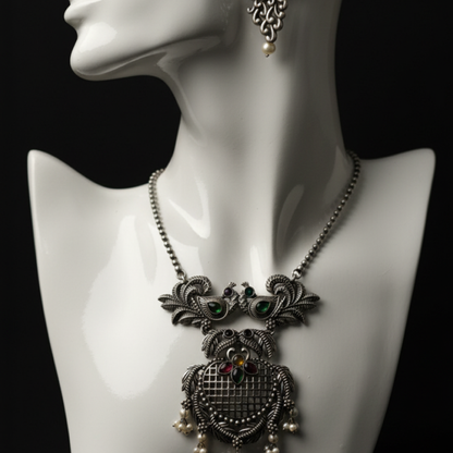 Oxidized silver necklace set with peacock design and multicolor stones by Revaaj Jewellery Stand