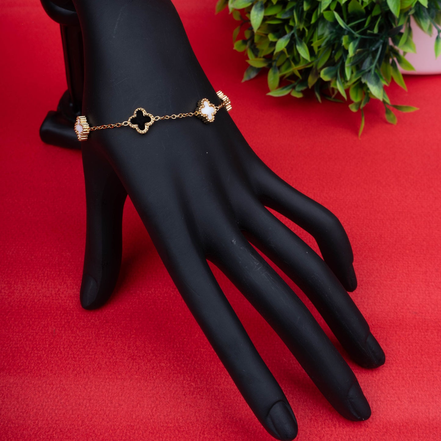 Black and white clover charm bracelet with delicate chain and intricate detailing second view - Revaaj